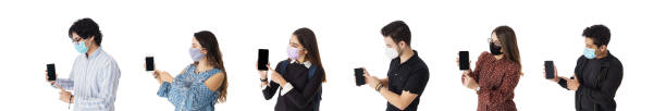 istock Latin students in a row with face masks showing  screen phone 1386028682