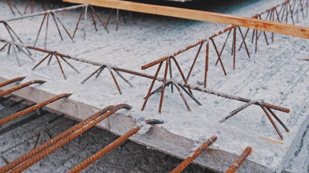 istock Stacked Perfabricated Precast Rebar Reinforced Concrete Ceiling Slabs Stored Outdoors on Construction Site 1386029512