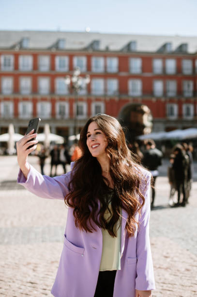istock Young woman taking a selfie 1386029950