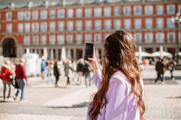 istock Woman taking a picture with a smart phone 1386029953