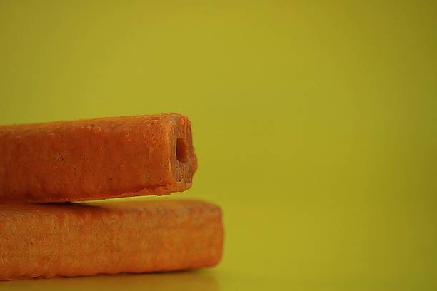 istock a stack of food on a yellow background 1386030176