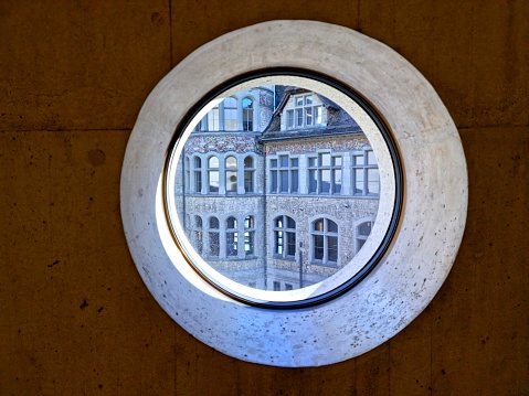 Switzerland's most frequently visited museum of cultural history represents our history from its origins to the present day. The Museum is located next o the Zurich Railway Main Station. The image was captured from the museum through modern concret window.