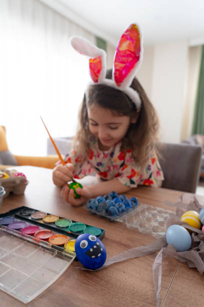 istock Girl wearing bunny ears 1386032750