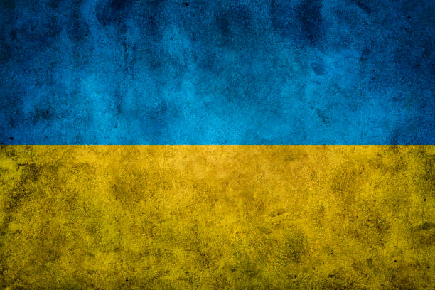 istock Grunge Wall Texture Background in Ukrainian Colors Flag 1386033332