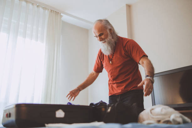 istock A mature man packing for a trip 1386033451