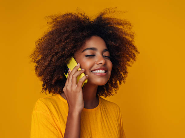istock Woman holding a smart phone 1386036148
