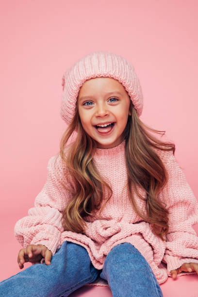 Portrait Of Cute Girl At The Studio Portrait Of Cute Girl At The Studio kids winter fashion stock pictures, royalty-free photos & images