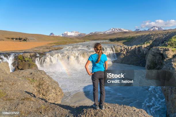 Women Standing In Front Of Gýgjarfoss Waterfall Near The Road To Kerlingarfjöll Stock Photo - Download Image Now
