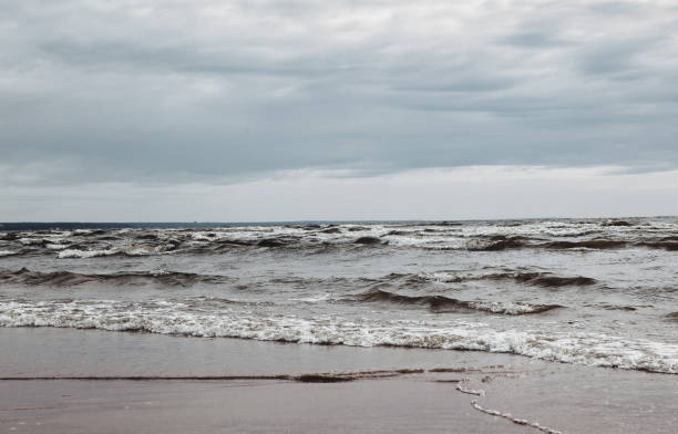 istock Atmospheric scenery Dramatic Baltic sea, waves and water splashes on breakwaters 1386040765