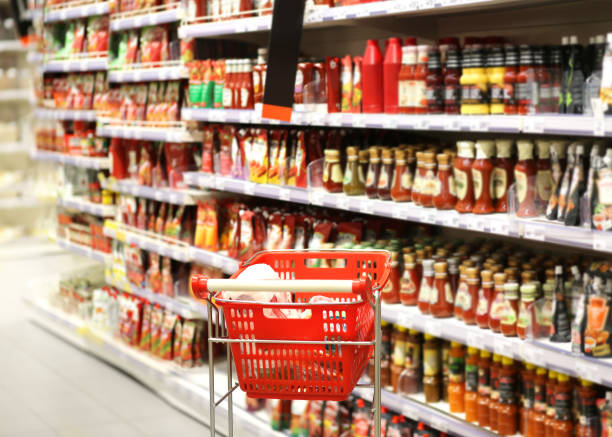 istock empty grocery cart in an empty supermarket 1386051358