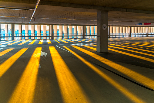 Empty Parking Garage at dawn, rays of sunlight hit the tarmac.Amsterdam, the Netherlands.