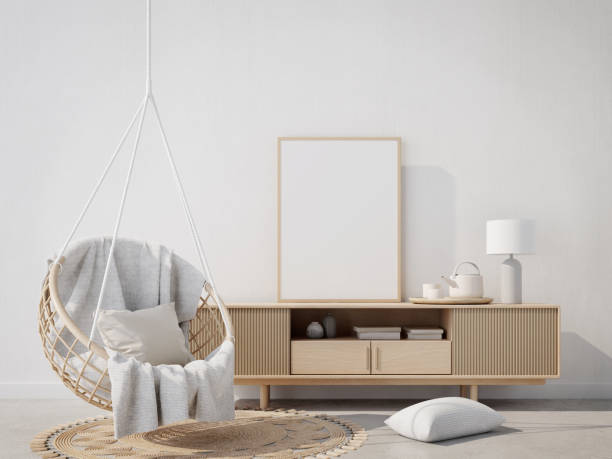 istock Boho style interior with hanging chair,table,blank canvas and white wall background.3d rendering 1386056003
