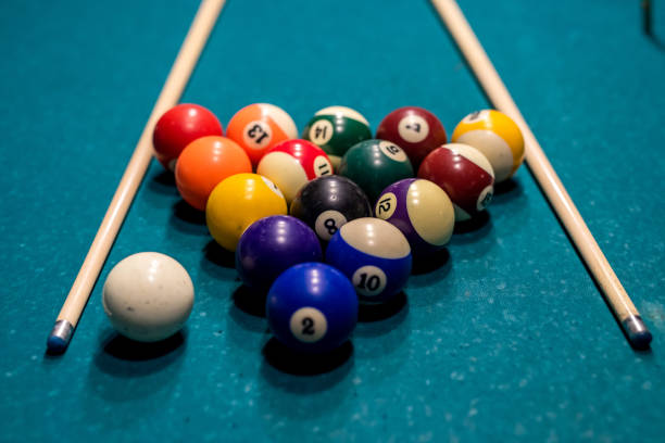 istock Billiard balls in a green pool table, ready for recreational activity 1386058943