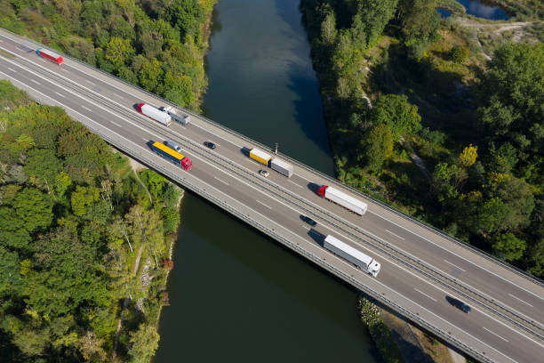 istock World at Work, Heavy Cargo on Highway Bridge, Aerial View 1386064722