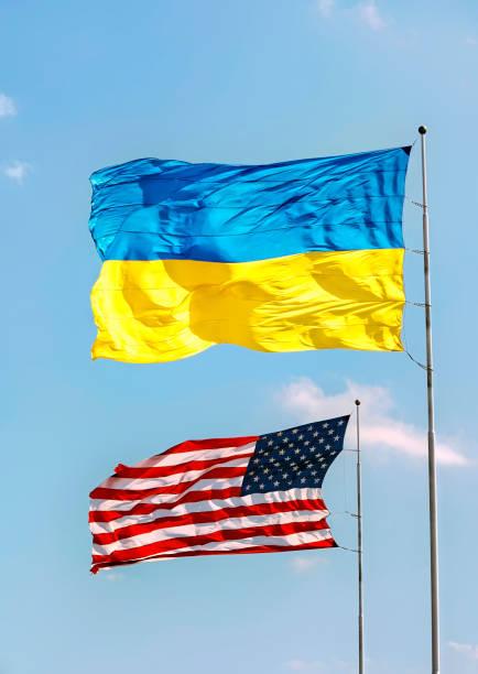 Ukraine and American Flags. Ukraine and American flag flying togeather with pride. teamwork slogan stock pictures, royalty-free photos & images