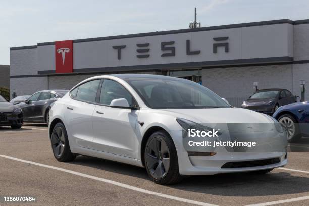 Tesla Ev Electric Vehicles On Display Tesla Products Include Electric Cars Battery Energy Storage And Solar Panels Stock Photo - Download Image Now