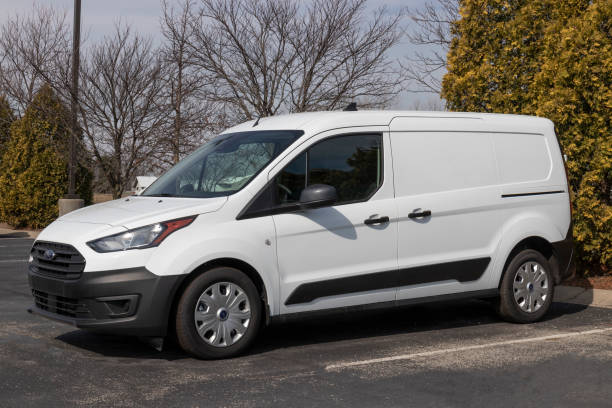 ford transit connect display at a dealership. ford offers the transit connect in xl and xlt cargo vans and xlt passenger wagon models. - domestic car color image horizontal car imagens e fotografias de stock