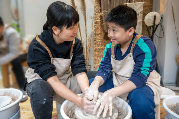 istock Mother and boy make ceramics at home 1386077936