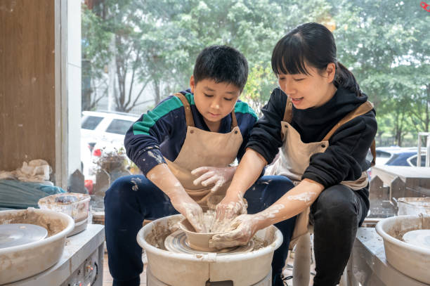 istock Mother and boy make ceramics at home 1386077949