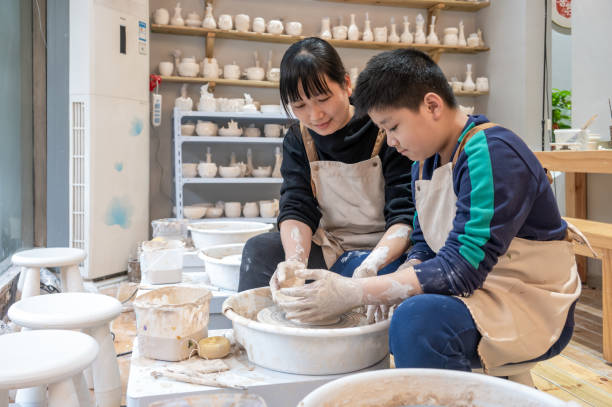 istock Mother and boy make ceramics at home 1386077986