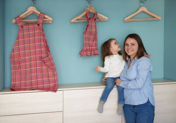 istock Mother and daughter with similar clothes 1386079459