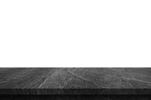 istock Black marble stone table top isolated on white background 1386079560