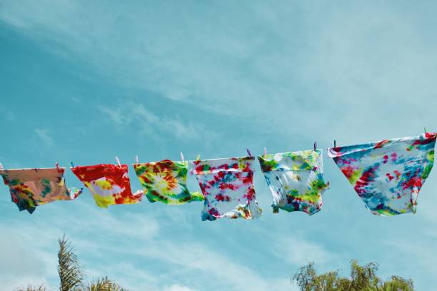 istock Tie-Dye T-Shirts on Washing Line 1386084860