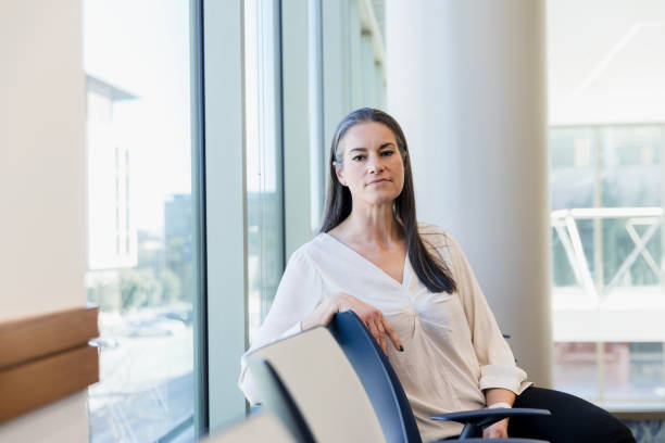 istock Portrait serious female hospital administrator 1386085663