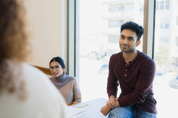 istock Unrecognizable teacher speaks to relaxed group of students 1386085720