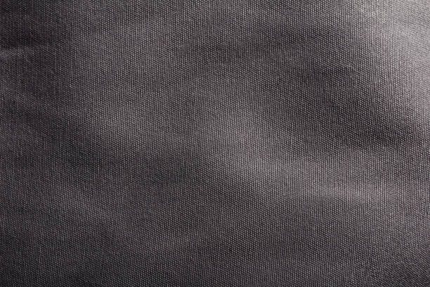 istock Dark grey cloth texture close-up photo. 1386092237