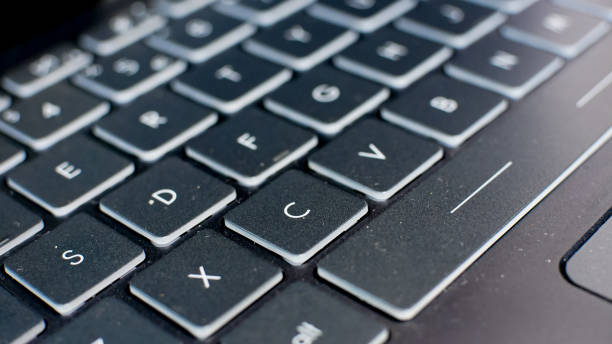 istock close up of Computer Keyboard for background. technology and business concept 1386092356