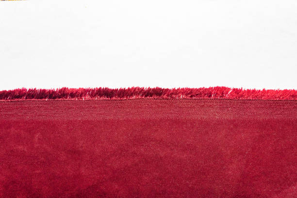 Texture backdrop photo of red colored cotton cloth edge. stock photo