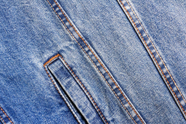 istock Texture backdrop photo of blue colored denim cloth. 1386094392