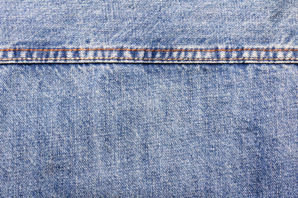 istock Texture backdrop photo of blue colored denim cloth. 1386094458
