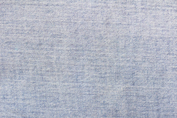 istock Texture backdrop photo of light blue colored denim cloth. 1386094471