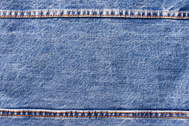 istock Texture backdrop photo of blue colored denim cloth. 1386094542