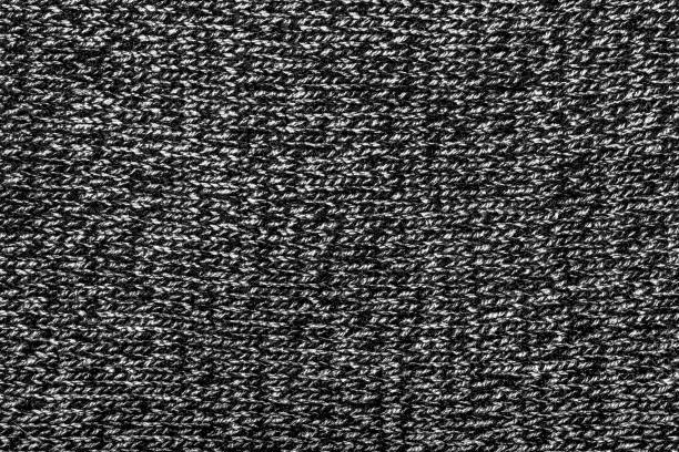 istock Knitted fabric cloth texture backdrop photo. 1386094556