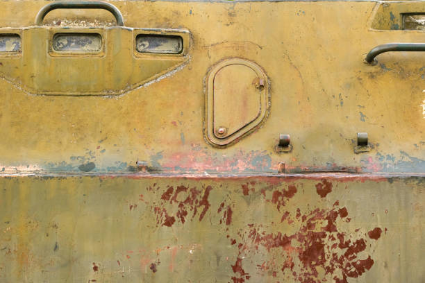 istock Old and rusty military vehicle armored surface. 1386095986