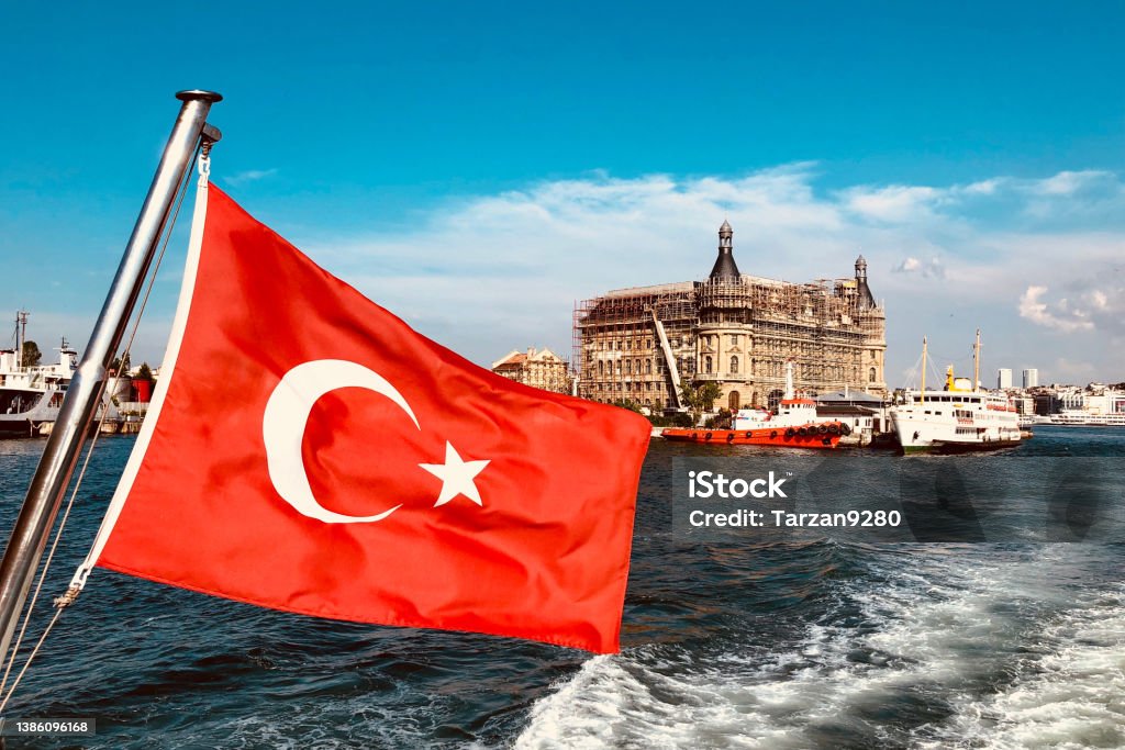Turkish flag and Haydarpasa train station in Istanbul, Turkey Turkish Flag Stock Photo