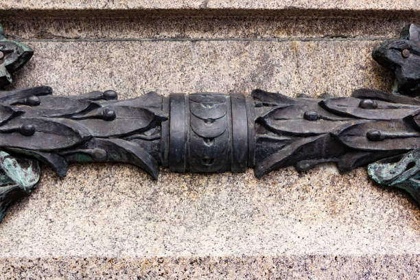 istock Concrete wall texture with metal ornament. 1386096843