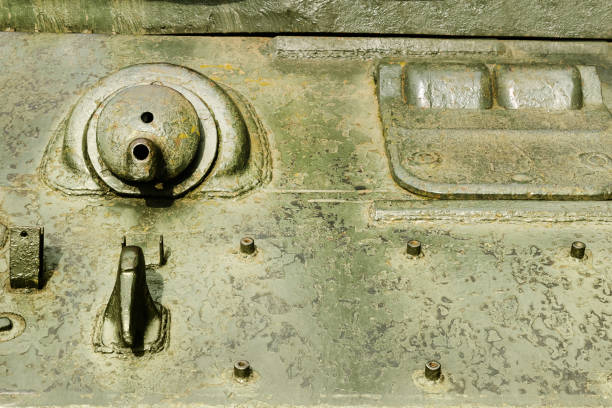 Close-Up Of A Rusted Industrial Metal Shaft And Flange On Abandoned Machinery, Showing Corrosion, Wear, And Aging Equipment In An Outdoor Industrial Environment.