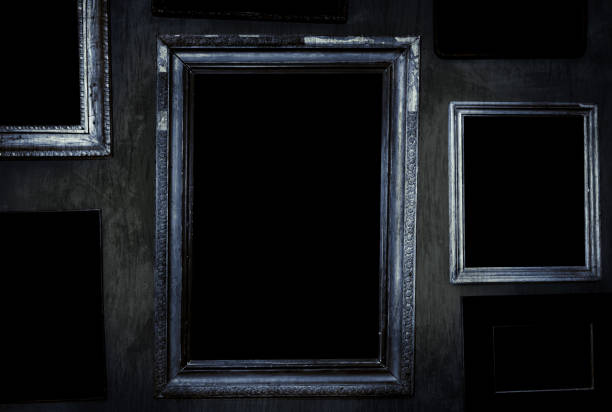 Scary horror haunted black picture frames on wall.