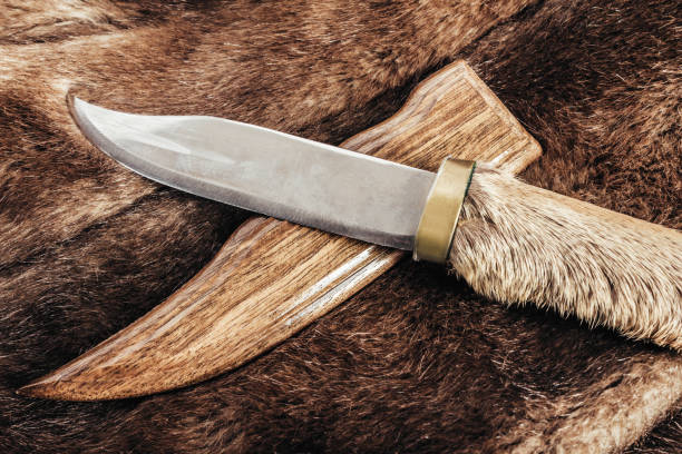 brown colored animal fur with hunting knife. - close up shiny merchandise rough imagens e fotografias de stock