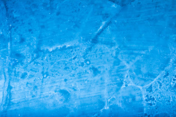 istock Blue toned frozen transparent ice texture. 1386100222