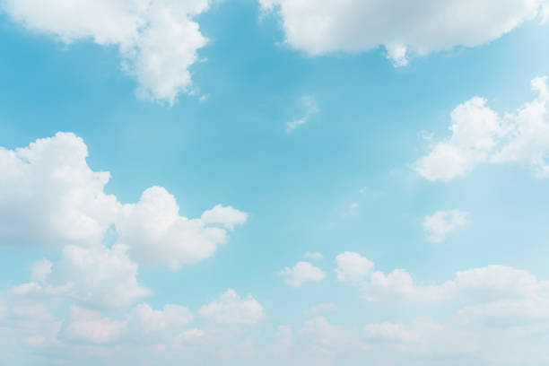 istock Blue sky and clouds with sun and daylight natural background. 1386100416