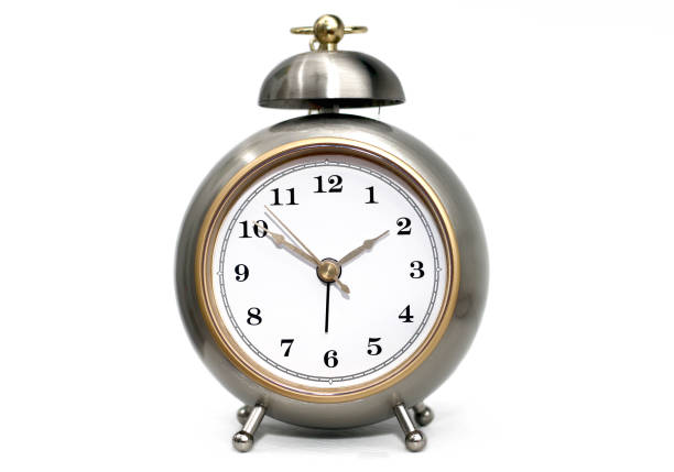 istock Metallic alarm clock with single bell on white background 1386107697