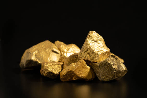 istock The pure gold ore found in the mine on black background 1386107771