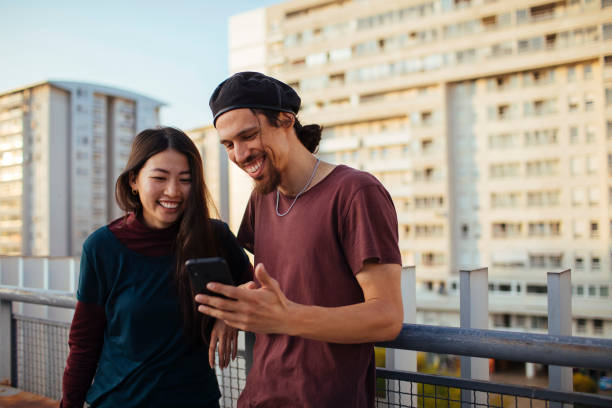 istock Friends looking at the phone 1386108782