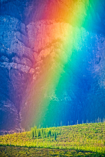 Vivid rainbow over the Rocky Mountain in Jasper National Park