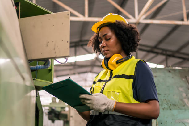istock Industrial factory concept. Engineering technician or worker operating and maintenance of machinery. 1386113874